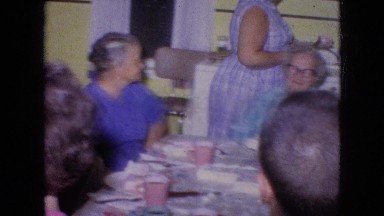 1964: family gathering having tea time excited