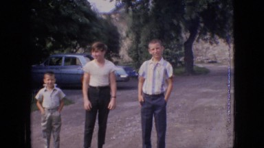 1964: a man and three boys standing in a dirt parking lot PHILADELPHIA