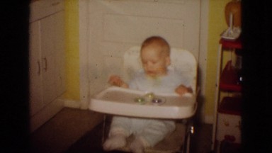1965: little boy relaxing in his highchair. NEW JERSEY