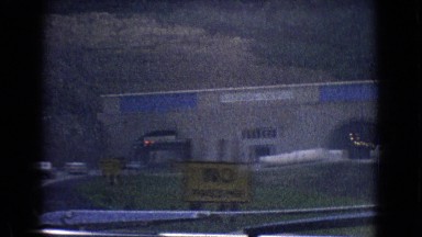 1965: vehicles are streaming through a road entering a large enclave NEW JERSEY