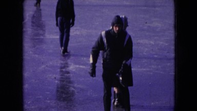 1966: various people in heavy coats ice-skating on frozen water ATHENS OHIO