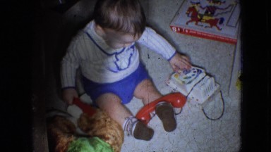 1966: little baby sitting on the floor, playing with his toys. ATHENS OHIO