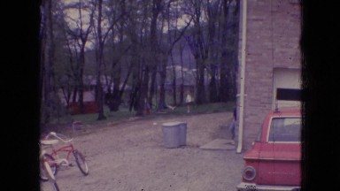 1966: house car parked child sitting swing running trees