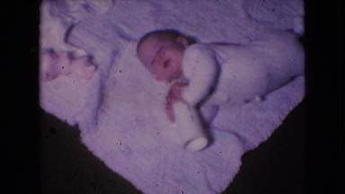 1966: little baby laying down with it's bottle. ATHENS OHIO