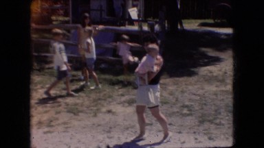 1966: the caring mother carrying a child through playground ATHENS OHIO
