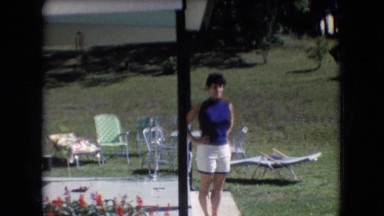 1966: a woman in white shorts and a blue top outside on the patio ATHENS OHIO