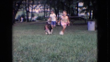 1966: children playing with basset hound in the yard. ATHENS OHIO