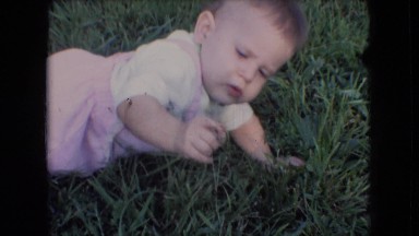 1966: baby playing in the grass ATHENS OHIO
