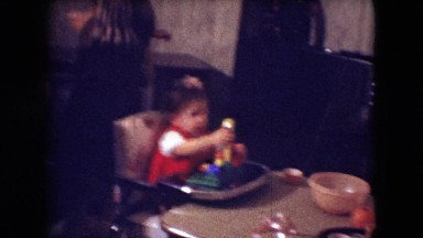 1966: little baby playing with her toy while sitting in her highchair. ATHENS