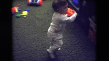 1966: cute child wearing pajamas indoor walking ATHENS OHIO