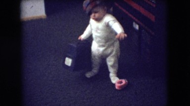 1966: a little baby with a hat attempting to walk ATHENS OHIO