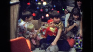 1966: children around a christmas tree opening gifts ATHENS OHIO