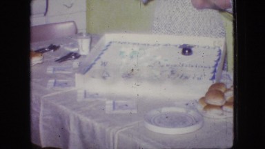 1966: a couple standing behind a cake and two boys in a field NEW JERSEY