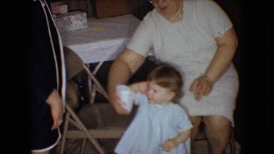 1966: women letting toddler drink from styrofoam cup OHIO