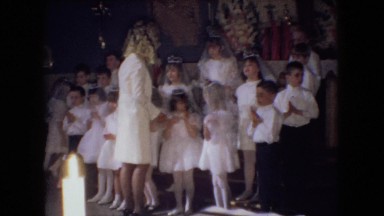 1966: several well-dressed boys and girls lined up in a church OHIO