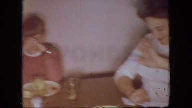 1966: a small white dog walks around a room and looks at the camera OHIO