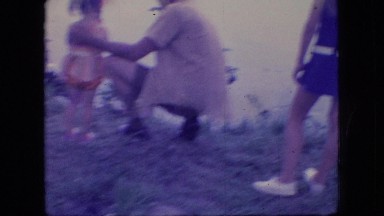 1966: cute little girl standing, father holding seeing fish