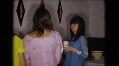 1966: girls standing holding cup drinking eating lady taking food talking OHIO