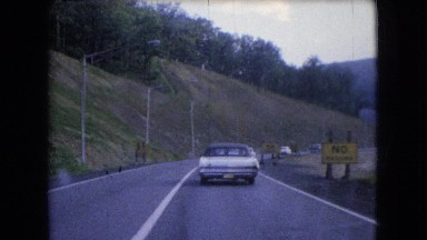 1966: a highway passing through a tunnel where many vehicles running