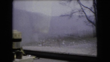 1966: a vehicle is travelling through a hilly area in the drizzle OHIO