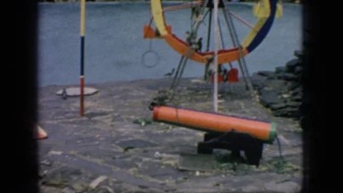 1966: monkeys at the zoo playing on a ferris wheel jungle gym and trapeze rings