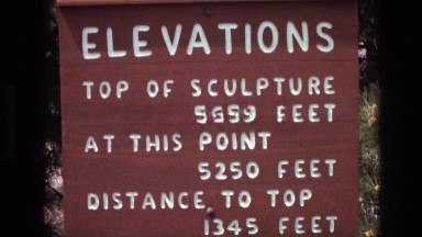 1974: elevation sign showing height of sculpture, current height and distance