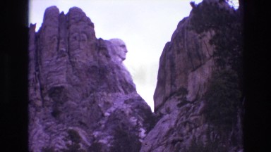 1974: hilly area statue carved roads rocky terrain