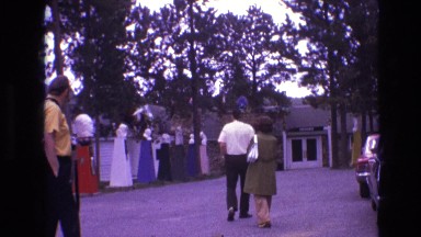 1974: outdoor family scene walking man with camera walking back SOUTH DAKOTA