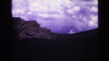 1974: a dark silhouette of mountain ridge under a cloudy sky SOUTH DAKOTA