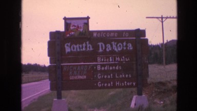 1974: rustic sign from 1970s reading: "welcome to south dakota, black hills