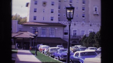 1967: people entering a large building and car passing by COLORADO SPRINGS