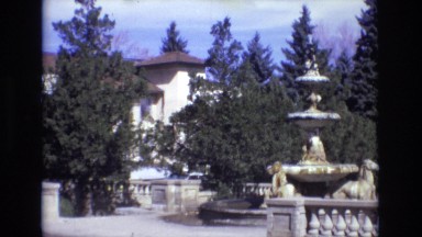 1967: zooming in on the cars driving by the house. COLORADO SPRINGS BROADMOR