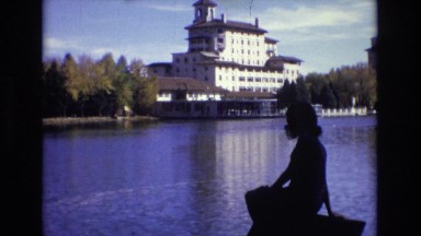 1967: a woman in silhouette, looking out over a large body of water COLORADO