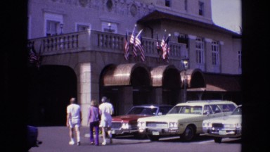 1967: random people walking into a public building in the city. COLORADO SPRINGS