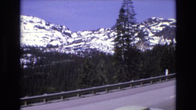 1966: a road through a beautiful winter mountain LAKE TAHOE NEVADA