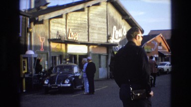 1965: People Casually Walking Around Downtown Central Coast California