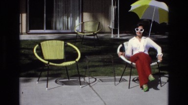 1965: lady sitting in a chair and a man sits beside her CENTRAL COAST CALIFORNIA