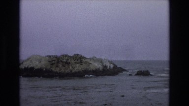 1965: an island made of rock in a body of water CENTRAL COAST CALIFORNIA