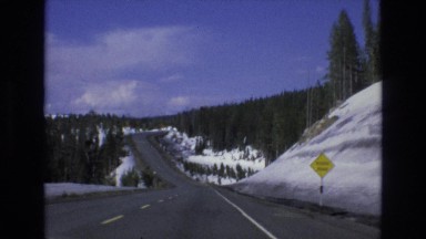 1966: driving down the highway in the wintertime. LAKE TAHOE NEVADA