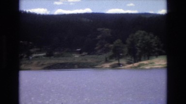 1966: a large lake surrounded by beautiful rolling hills and trees LAKE TAHOE