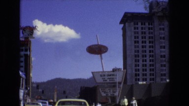 1966: cars moving in a city area huge buildings LAKE TAHOE NEVADA