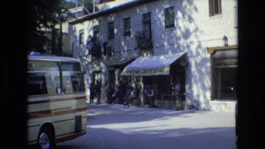 1969: People Standing on Street in Front of Building Spain