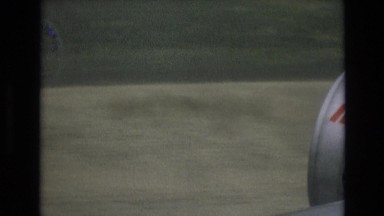 1969: airplane is flying near to a land with grasslands and village road SPAIN