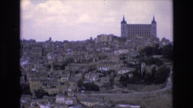 1969: european-style stone buildings and homes on a hillside SPAIN