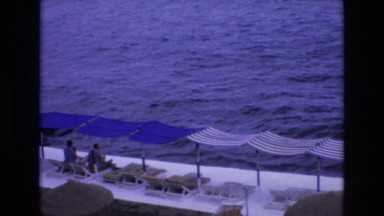 1969: Beautiful Coastal Scene with Blue Sea and Waves in Spain