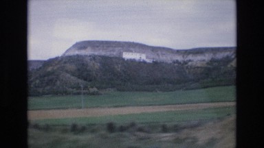 1969: A Mountain Ridge and Countryside Seen from a Moving Vehicle in Spain
