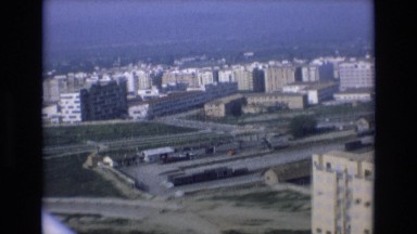 1969: View of an Oceanfront City Skyline, Streets, and Endless Blue Horizon
