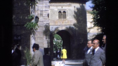 1969: Visitors Socializing in Front of a Beautiful Building, SPAIN