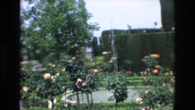 1969: View of a Beautifully Landscaped Garden with Stone Structure in Background