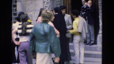 1969: Young Tourists Gather at Landmark Entry in Spain